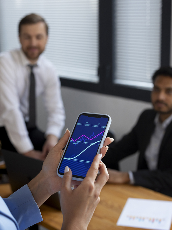 person-looking-finance-graphs (1) (1)